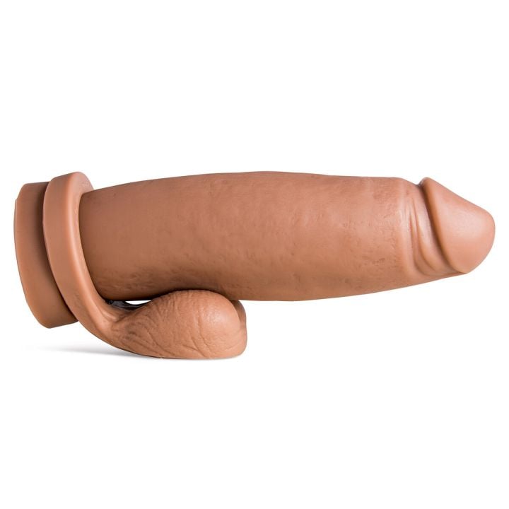 Boss Hog dildo in Natural Tan laying horizontally, side profile showing wide shaft, realistic veins, and optional Remove-O-Balls at base