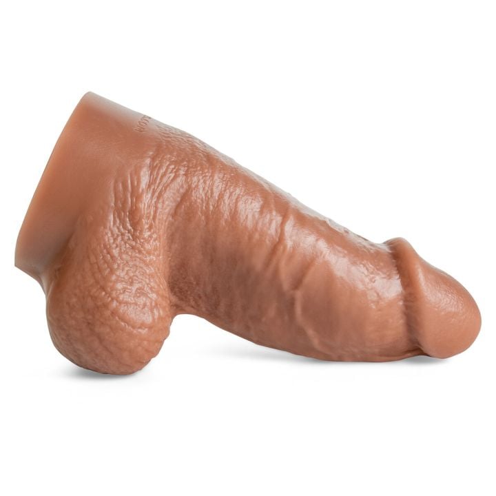 Clyde dildo by Mr. Hankey’s Toys laying horizontally, showcasing thick shaft, veined texture, and realistic sculpted head in Natural Tan silicone.