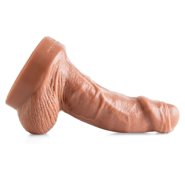 Side view of The Monster dildo showcasing sculpted veins, a lifelike foreskin design, and a bold shaft crafted from premium platinum-cured silicone.