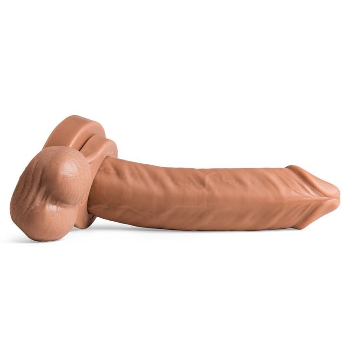 Full-length view of Anaconda dildo laid horizontally, showcasing skin-like texture and handcrafted silicone artistry with remove-o-balls.