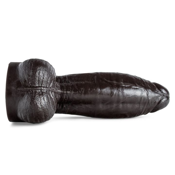 Dramatic under view of Atlas dildo in bold lighting, highlighting its lifelike texture, large size, nice balls, and BDSM-friendly design.