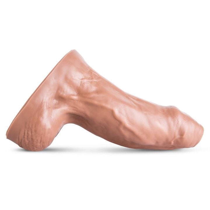 Side profile of the Goliath Realistic Dildo showing the sculpted shaft and broad base for stability during deep play.