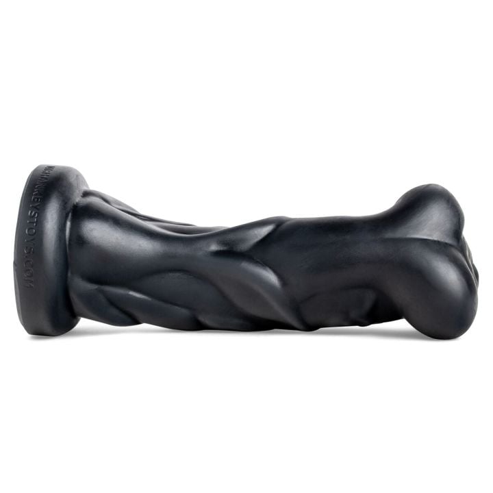 Kalib monster dildo lying flat, emphasizing handcrafted spiral design for deep, unpredictable sensation.