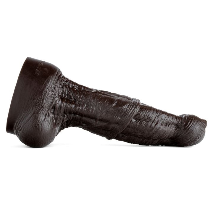 Side profile of Minotaur Dildo revealing pronounced veins and thick shaft, handcrafted for extreme stretch and primal stimulation.