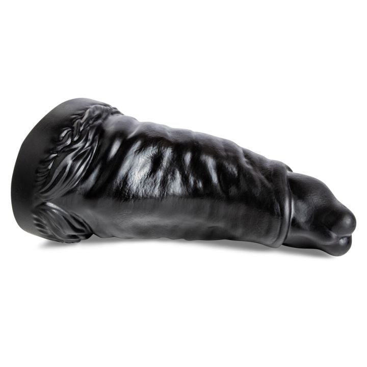 The Rabbit dildo in black silicone, lying horizontally to showcase its wide, tapered head and textured shaft.