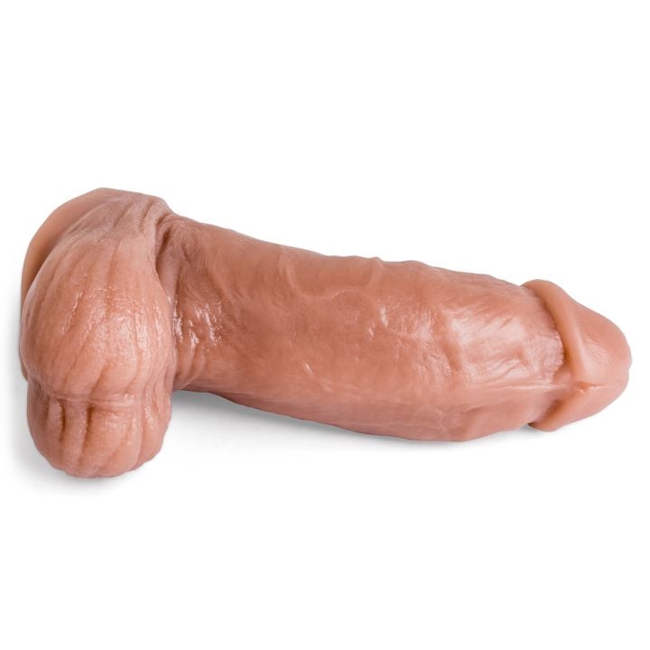Topher Michels realistic dildo lying flat, emphasizing full-length view and handcrafted anatomical accuracy.