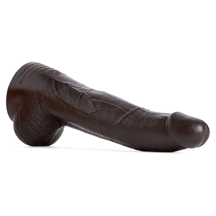 XG Chase dildo by Mr. Hankey’s Toys laying at an angle, showing hyper-realistic head, textured shaft, and detailed balls in Deep Brown