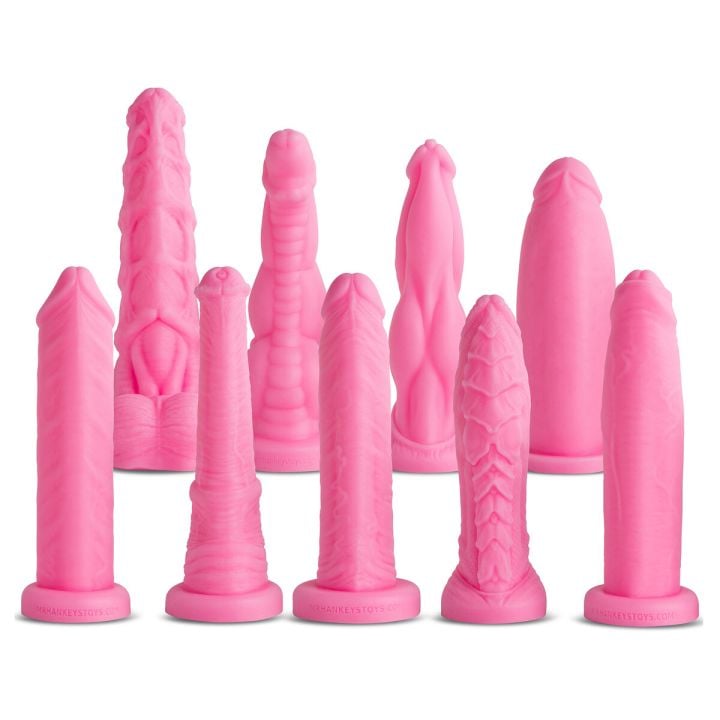 Group display of XTRA Small Dildo Series I in bubblegum pink showing the full collection of petite fantasy dildos by Mr. Hankey’s Toys.