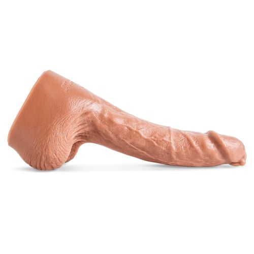 Drew Sebastian dildo by Mr. Hankey&rsquo;s Toys laying flat, side view showing curved shaft, textured veins, and lifelike sculpt in Natural Tan silicone.