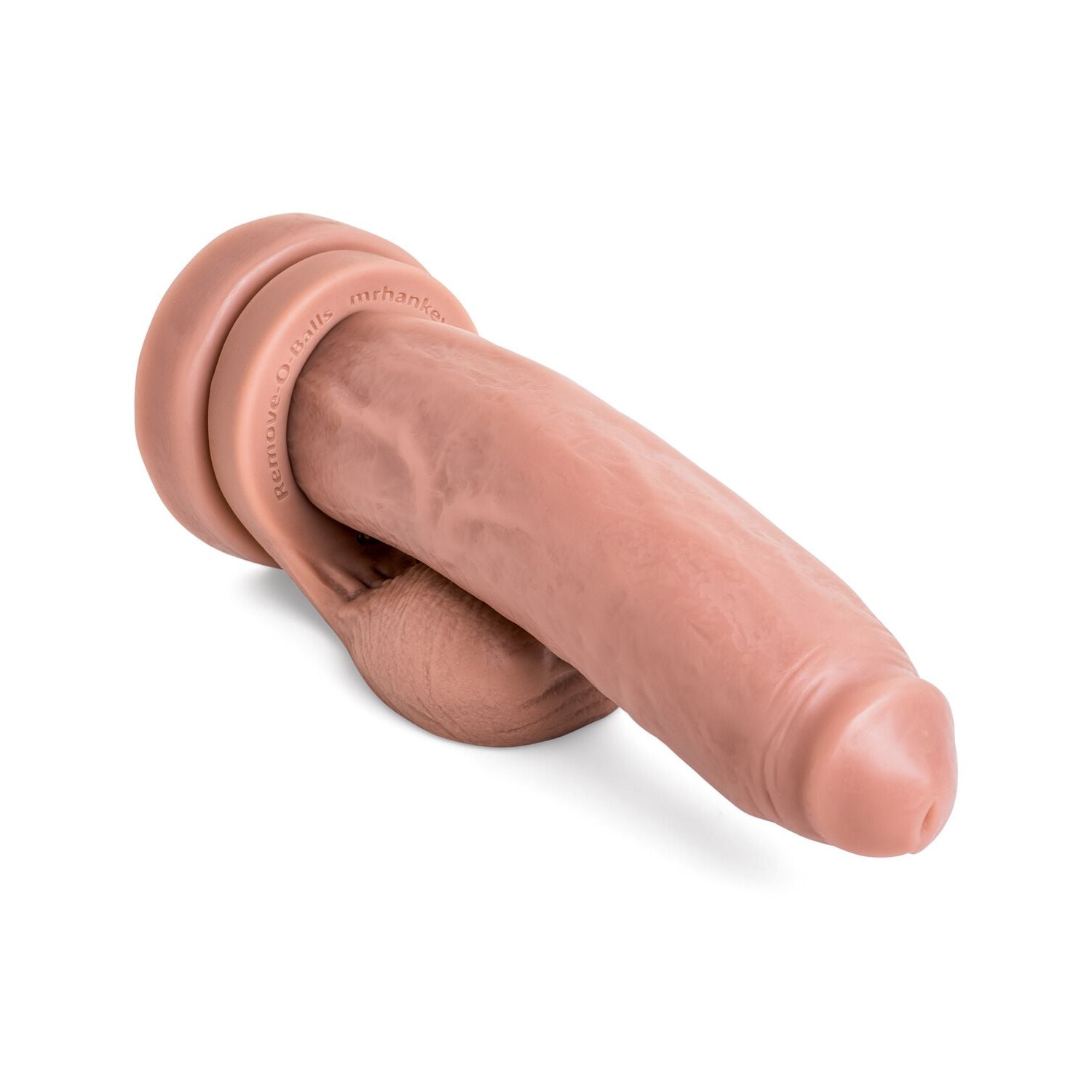 Angled view of the Cruiser dildo highlighting its circumcised head and handcrafted vein detail, crafted for smooth entry and bold penetration, pictured with Remove-o-Balls that are sold seperately.