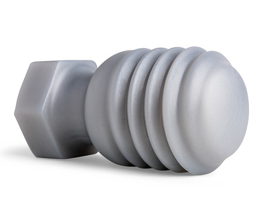 Angled image of the Butt Bolt Plug displaying its handcrafted silicone body and bold, sculpted shaft, designed for intense stretching sensations.