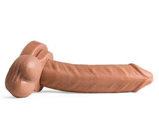 A large dildo laying on its side on a white background.