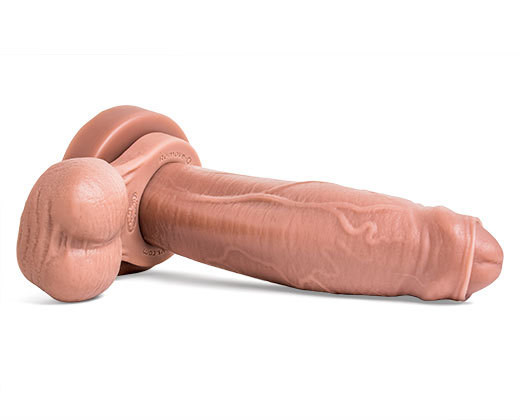 El Rey Realistic Dildo in Natural Tan color, showcasing its pronounced uncut head and textured shaft for lifelike sensation pictured with Remove-o-Balls sold seperately.