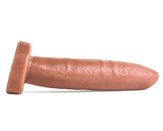 Tubesteak XXL uncut silicone depth trainer dildo laying flat, showcasing its smooth, straight shaft and tapered uncut head for deep anal play.