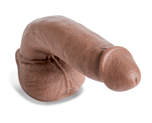 Realistic mold of a monster fair skin penis sitting on its balls