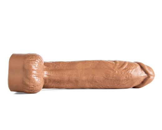 Rear-facing view of Cody Cachet laid flat, emphasizing the lifelike texture and ergonomic base, designed for safe and comfortable play.