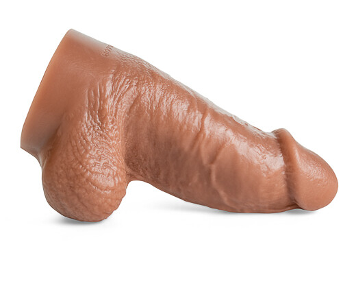 Clyde dildo by Mr. Hankey’s Toys laying horizontally, showcasing thick shaft, veined texture, and realistic sculpted head in Natural Tan silicone.