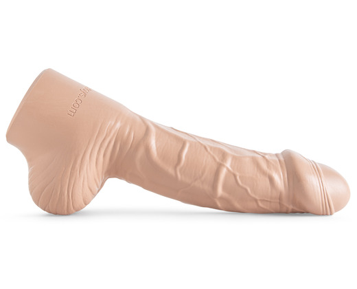 Hankey's Toys realistic Big Head dildo placed horizontally on a white background with the side profile facing the viewer.