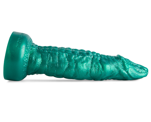 The turquoise cockadile dildo placed laying down horizontally with the tip of the product facing to the right. 