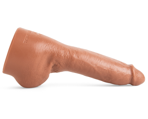 @ClementineXL dildo by Mr. Hankey’s Toys laying horizontally, Natural Tan tone with hyper-realistic shaft, detailed head, and life-cast design