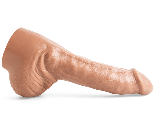 Ethan Sinns realistic dildo in Natural Tan laying flat, showcasing lifecast shaft with pronounced dorsal vein and sculpted anatomical detail.