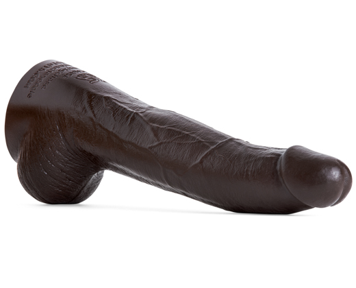 XG Chase dildo by Mr. Hankey’s Toys laying at an angle, showing hyper-realistic head, textured shaft, and detailed balls in Deep Brown