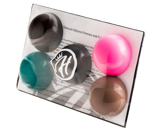 Mr. Hankey’s Toys Sample Pack in clear packaging displaying five silicone firmness samples in various colors, including Natural Tan, Metallic Green, Bubblegum Pink, Deep Brown, and Black.